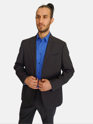 Man wearing a black suit and blue shirt on a white background